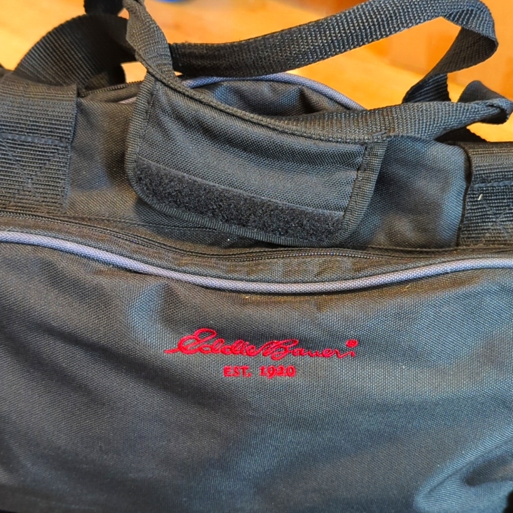 Eddie Bauer canvas rolling duffel travel bag for airports, wheels and a ll